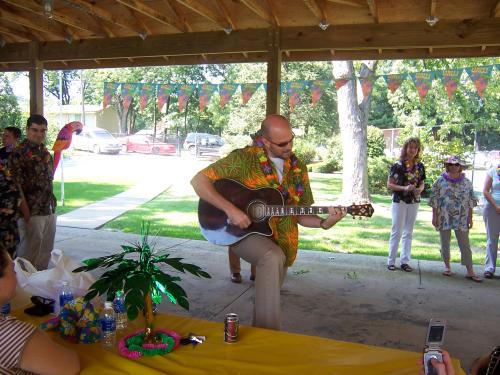 Staff Member Provides Entertainment at Annual Luau